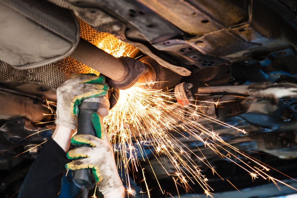 Exhaust work under a vehicle